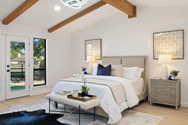 bedroom featuring light hardwood / wood-style floors, access to outside, and vaulted ceiling with beams