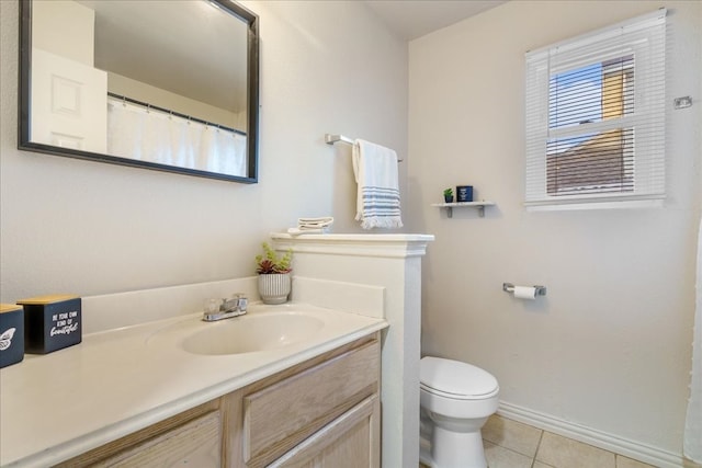 bathroom featuring vanity, toilet, and tile patterned floors