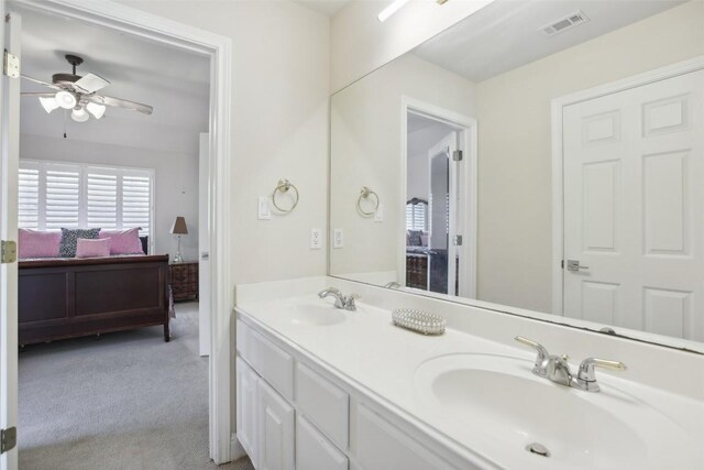 bathroom featuring ceiling fan and vanity