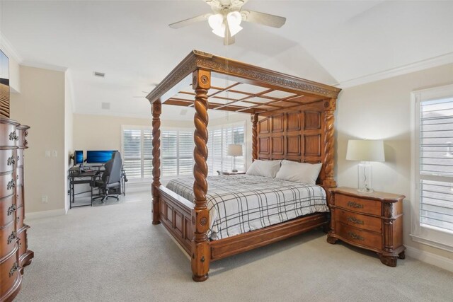 carpeted bedroom featuring multiple windows, crown molding, and ceiling fan