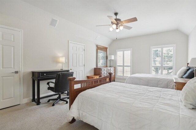 carpeted bedroom with ceiling fan and lofted ceiling