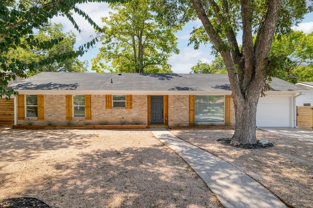 single story home featuring a garage