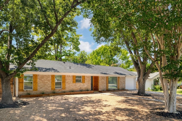 ranch-style house featuring a garage