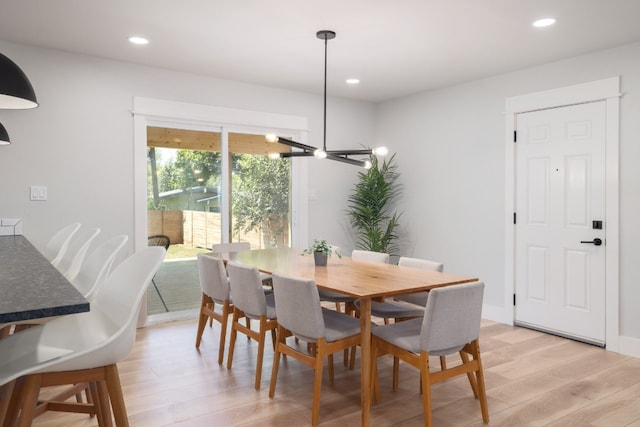 dining area with light hardwood / wood-style floors