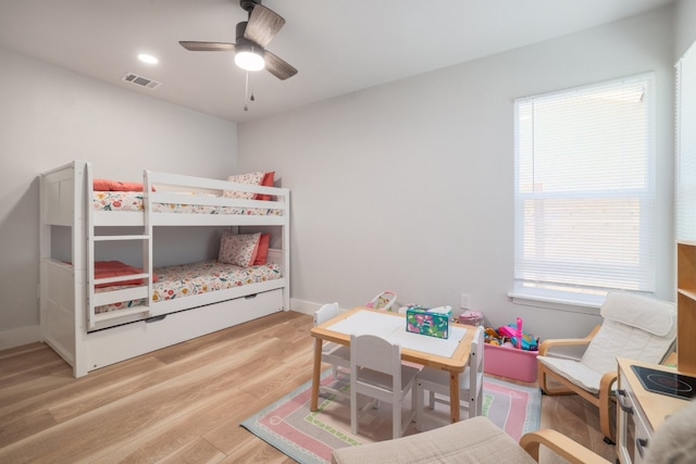 bedroom with ceiling fan and hardwood / wood-style flooring