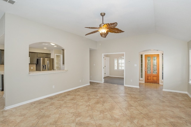 unfurnished room with ceiling fan and lofted ceiling