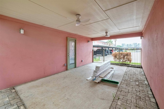 view of patio / terrace with a water view and ceiling fan