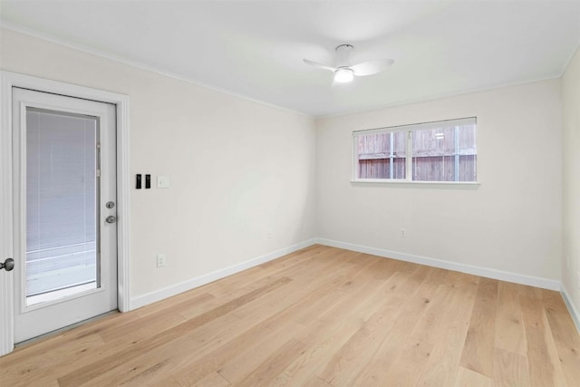 empty room featuring ornamental molding, ceiling fan, and light hardwood / wood-style flooring