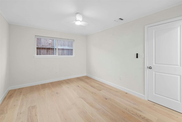 empty room featuring light hardwood / wood-style flooring and ceiling fan