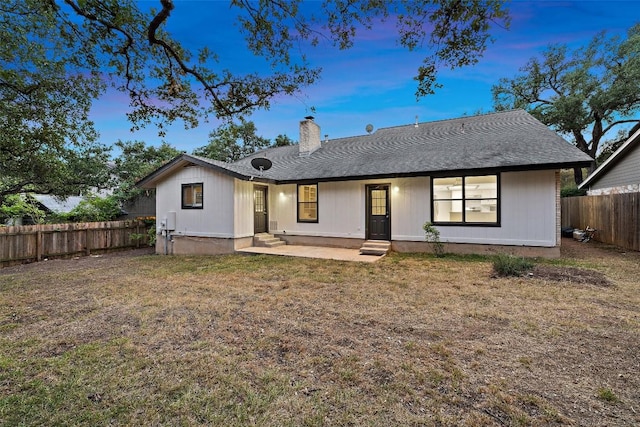 6700 Colina Ln, Austin, TX 78759 - view of front of property with a chimney, a fenced backyard, and a shingled roof