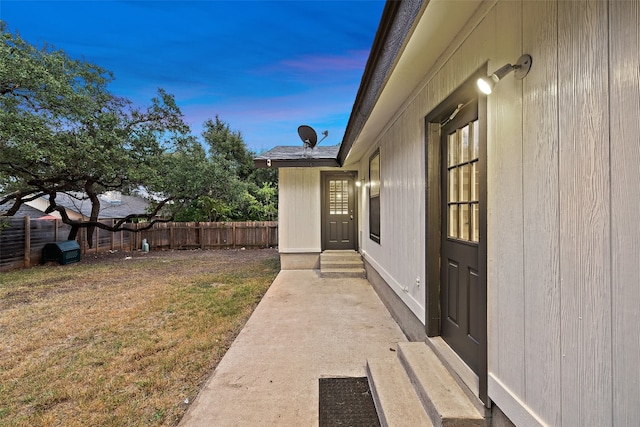 patio terrace at dusk with a lawn