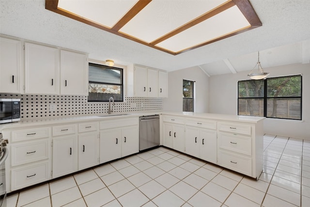 kitchen with white cabinetry, backsplash, kitchen peninsula, stainless steel appliances, and decorative light fixtures