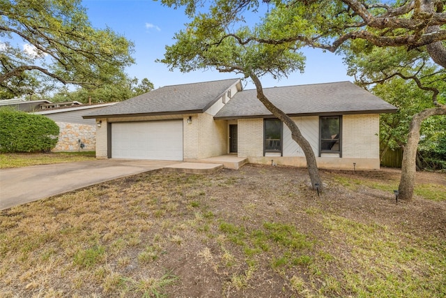 ranch-style home featuring a garage