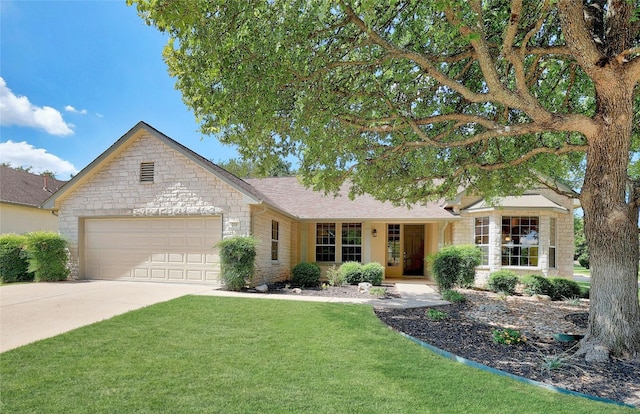 single story home featuring a front yard and a garage