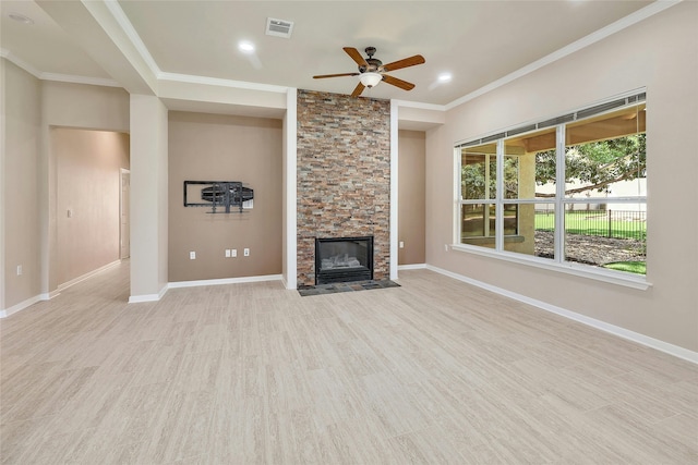 unfurnished living room with ceiling fan, light hardwood / wood-style floors, a stone fireplace, and crown molding