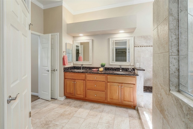 bathroom with crown molding and vanity