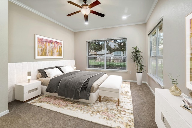 bedroom featuring ceiling fan, carpet floors, and ornamental molding