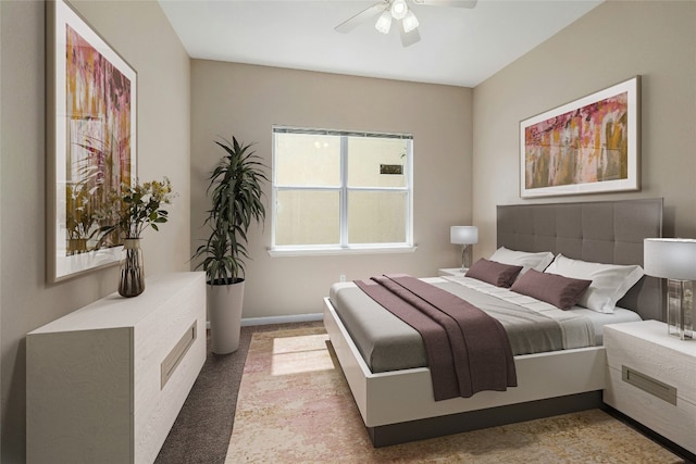 bedroom featuring ceiling fan and light colored carpet