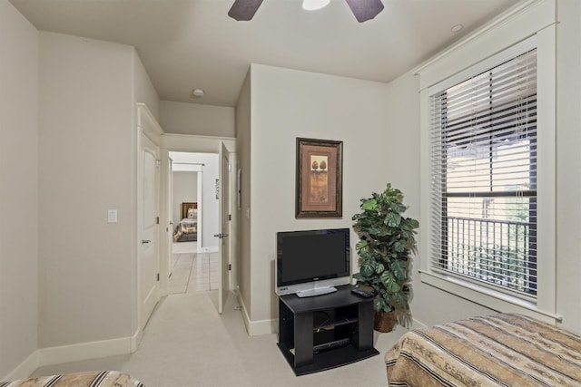 carpeted bedroom featuring ceiling fan