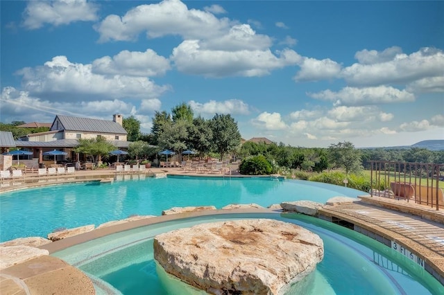 view of pool featuring a patio area