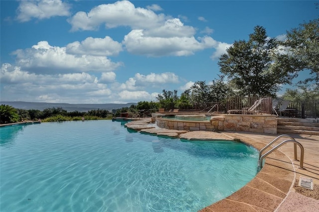 view of pool featuring a water view