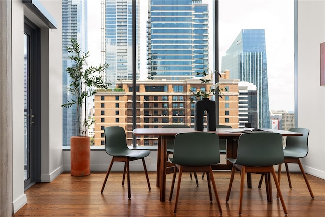 dining space with hardwood / wood-style flooring