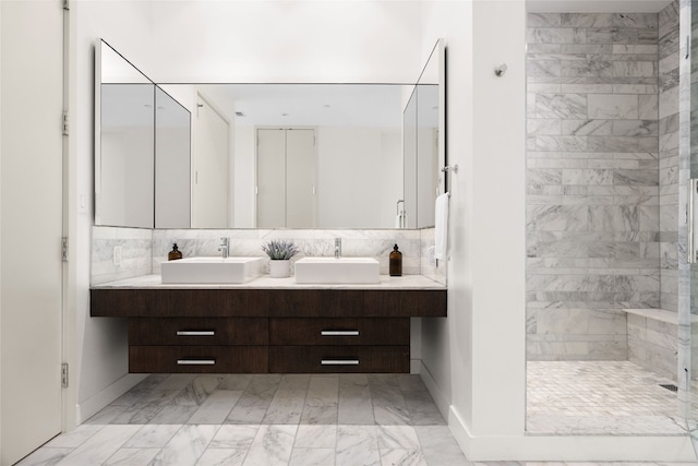 bathroom with a shower and vanity