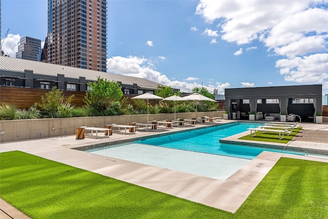 view of swimming pool featuring a patio