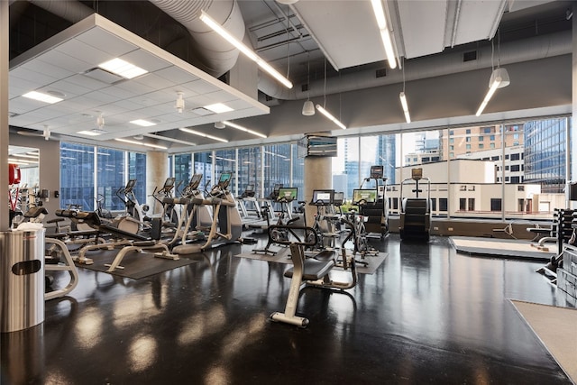 exercise room with a drop ceiling