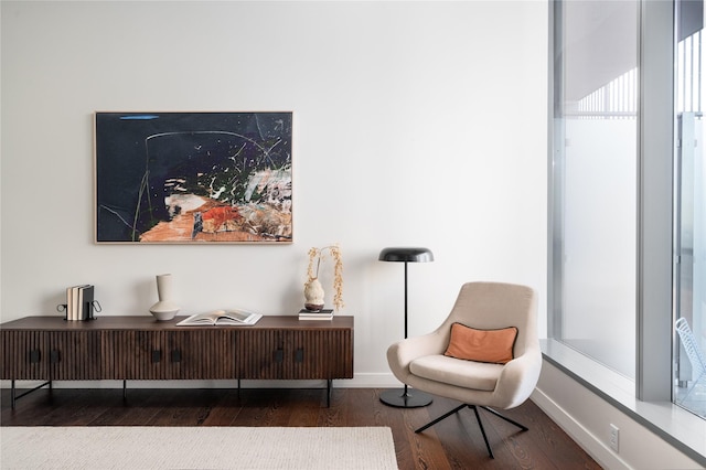 living area with hardwood / wood-style flooring