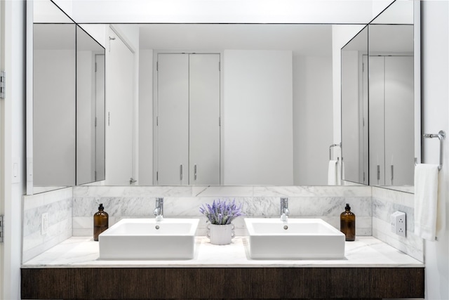 bathroom featuring backsplash and vanity