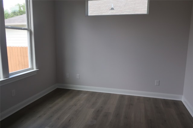 empty room featuring dark hardwood / wood-style flooring