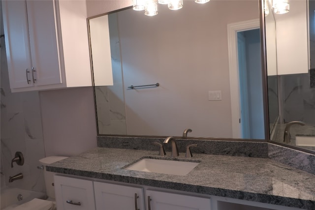 bathroom with bathing tub / shower combination and vanity