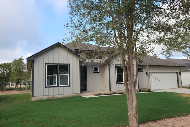 single story home with a garage and a front lawn