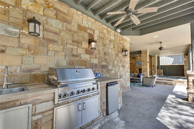 view of patio / terrace featuring ceiling fan, grilling area, sink, and exterior kitchen