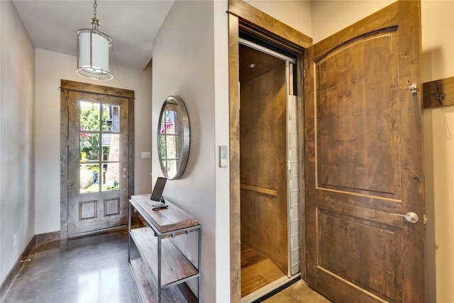 foyer entrance with concrete floors