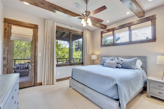 bedroom featuring multiple windows, beamed ceiling, and ceiling fan