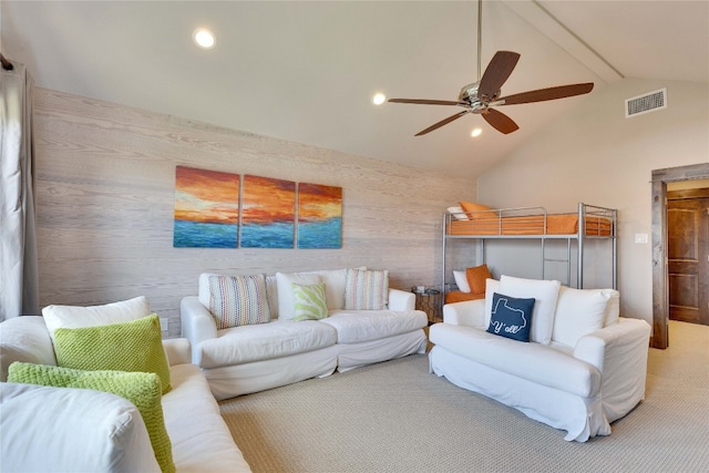 living room featuring carpet, vaulted ceiling with beams, and ceiling fan