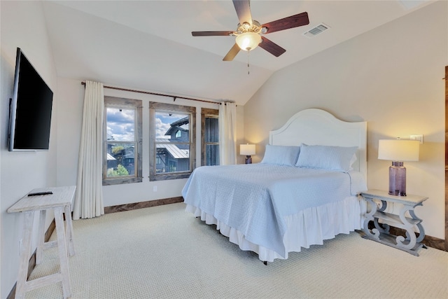 carpeted bedroom featuring lofted ceiling and ceiling fan