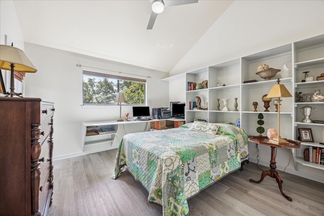 bedroom featuring hardwood / wood-style flooring, ceiling fan, and lofted ceiling