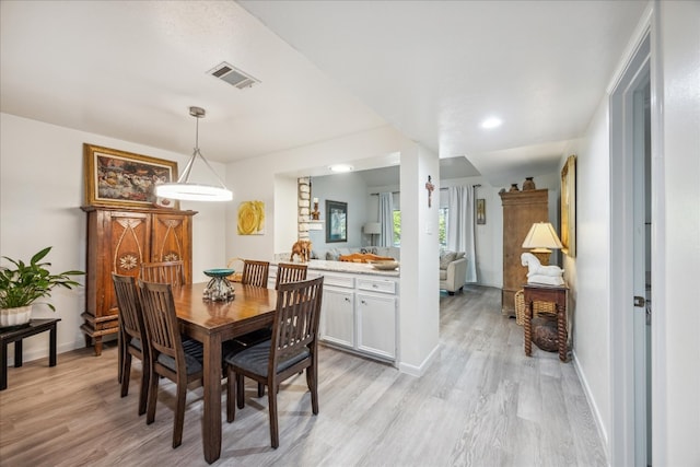 dining room with light wood-type flooring