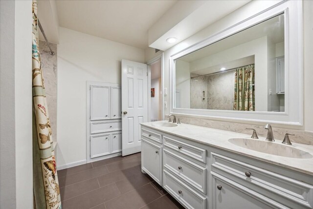 bathroom with vanity, tile patterned floors, and walk in shower