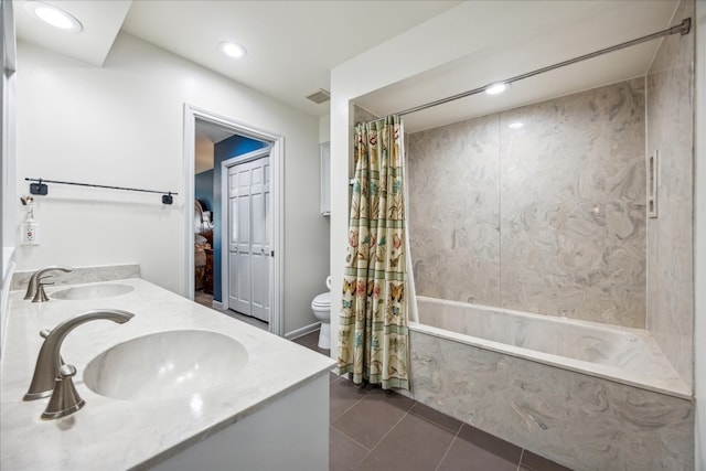 full bathroom with shower / tub combo with curtain, tile patterned floors, toilet, and vanity