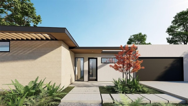 doorway to property featuring a garage