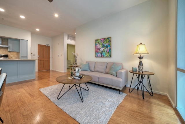 living room with light hardwood / wood-style flooring