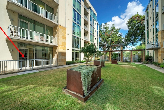 view of home's community featuring a lawn