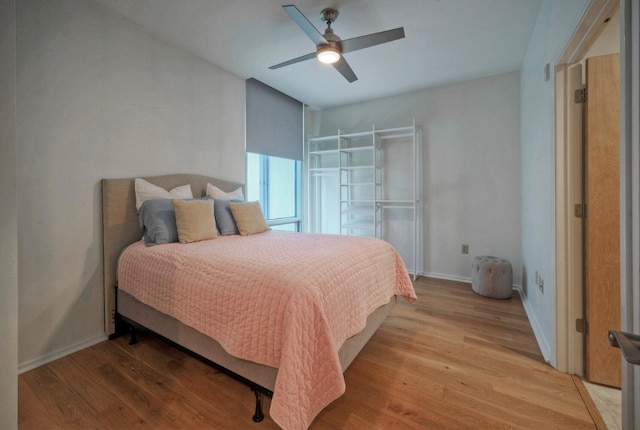 bedroom featuring light wood-type flooring and ceiling fan