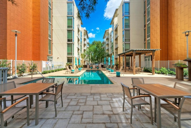 view of swimming pool featuring a pergola and a patio area