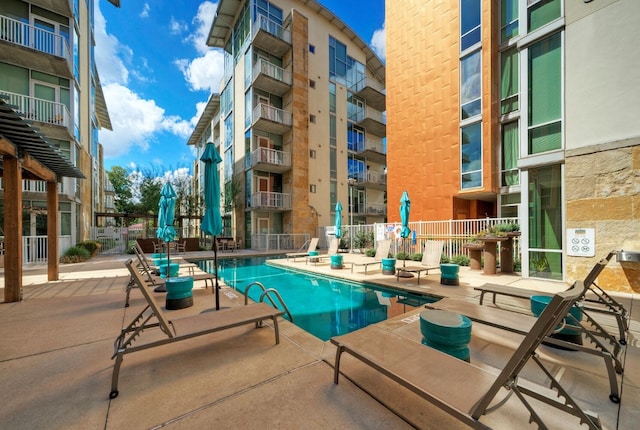 view of pool featuring a patio area