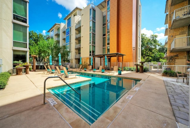 view of swimming pool featuring a patio area